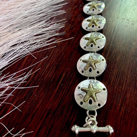 Silver sand dollar link bracelet. 7” includes clasp. - Picture 5 of 7